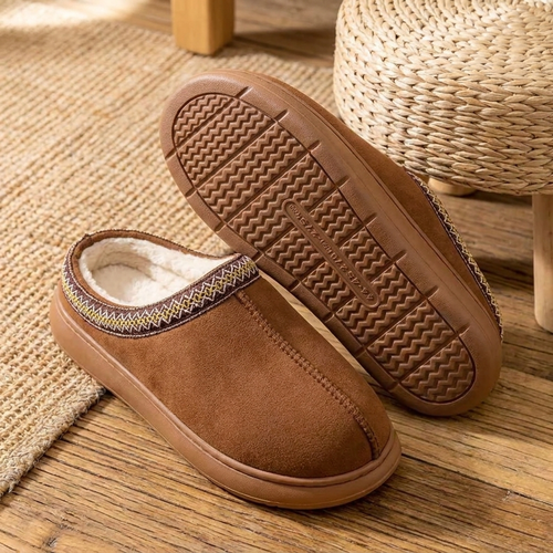 Slippers showing the plush lining and the textured EVA sole