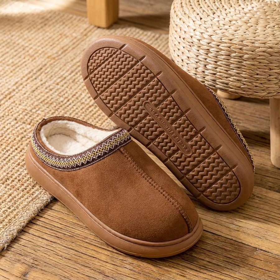 Slippers showing the plush lining and the textured EVA sole