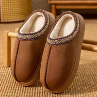 Pair of chestnut slippers with plush lining and embroidered trim